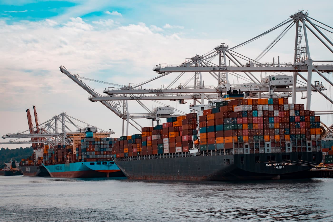 Container ship loading freight at port
